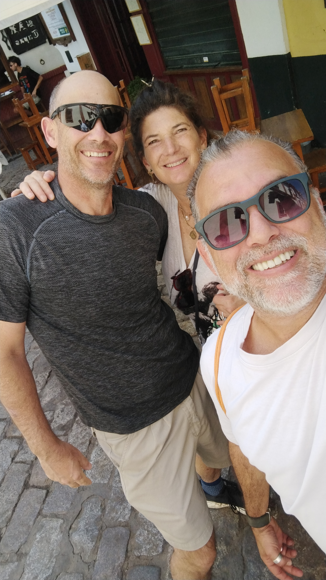 Johnny with a couple outside a traditional Sevillian tavern