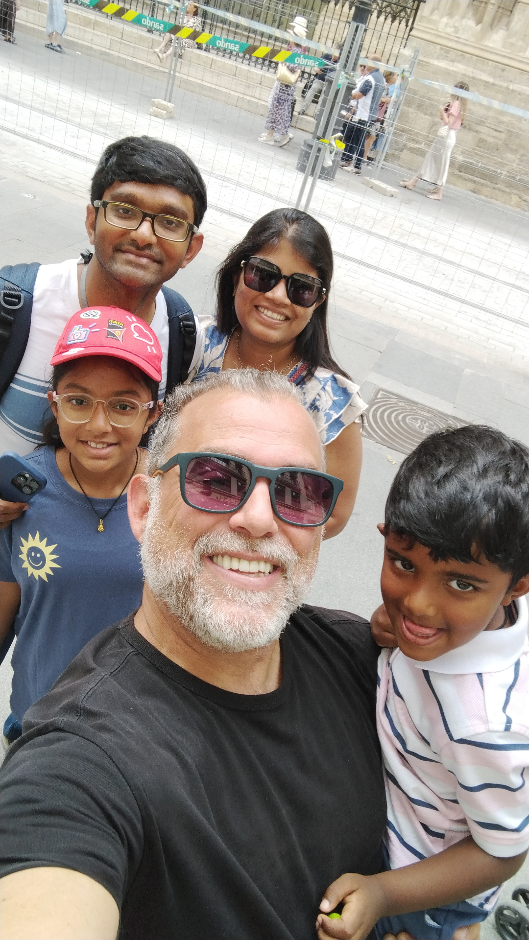 Johnny selfie with a family of guests at Seville Cathedral