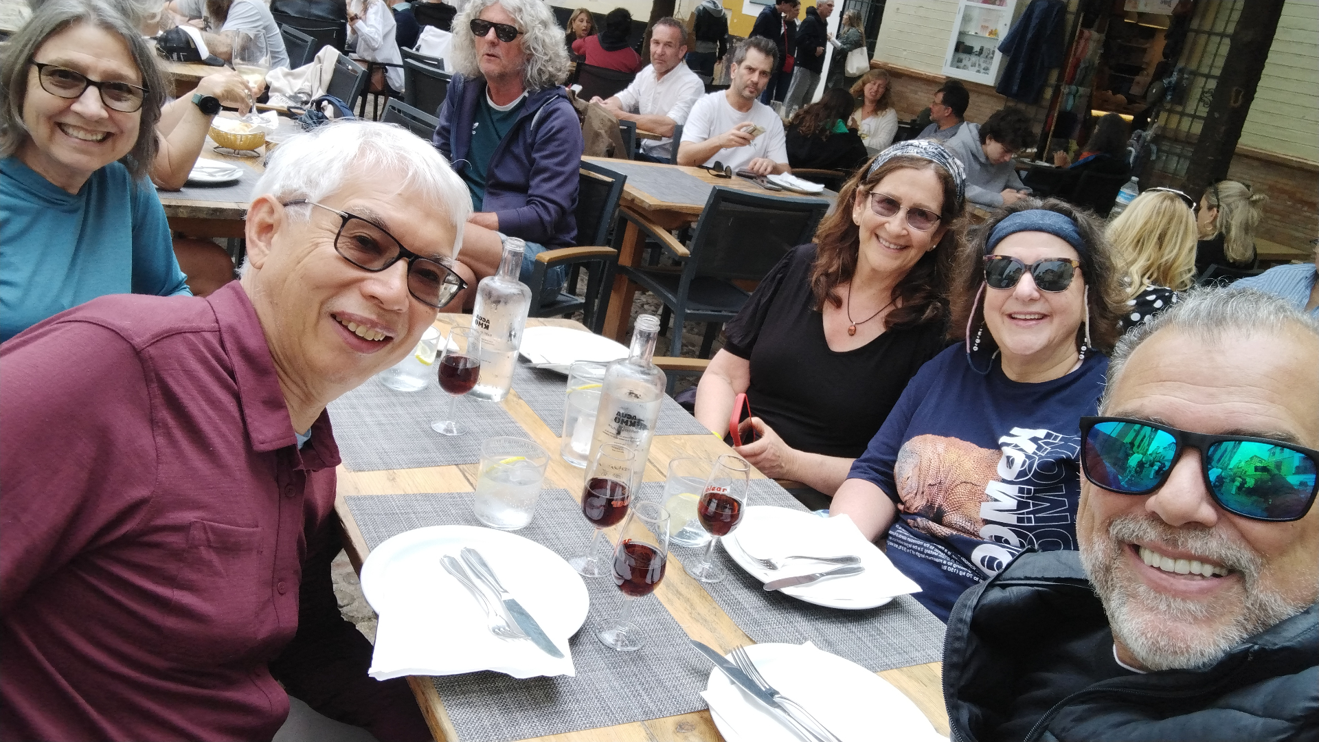 Johnny at an outdoor lunch with a group of travelers