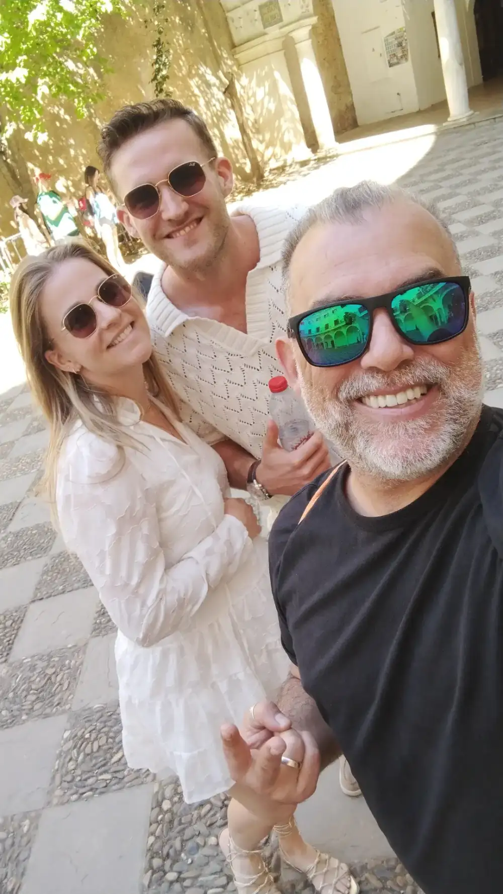 Johnny with guests at a Sevillian courtyard